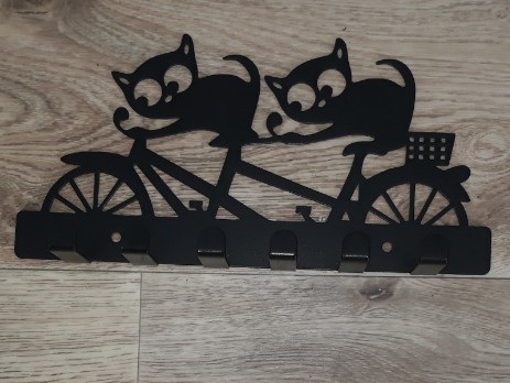 Black metal hanger cats on bicycle