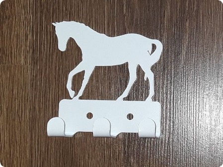 Mały metalowy wieszak koń biały